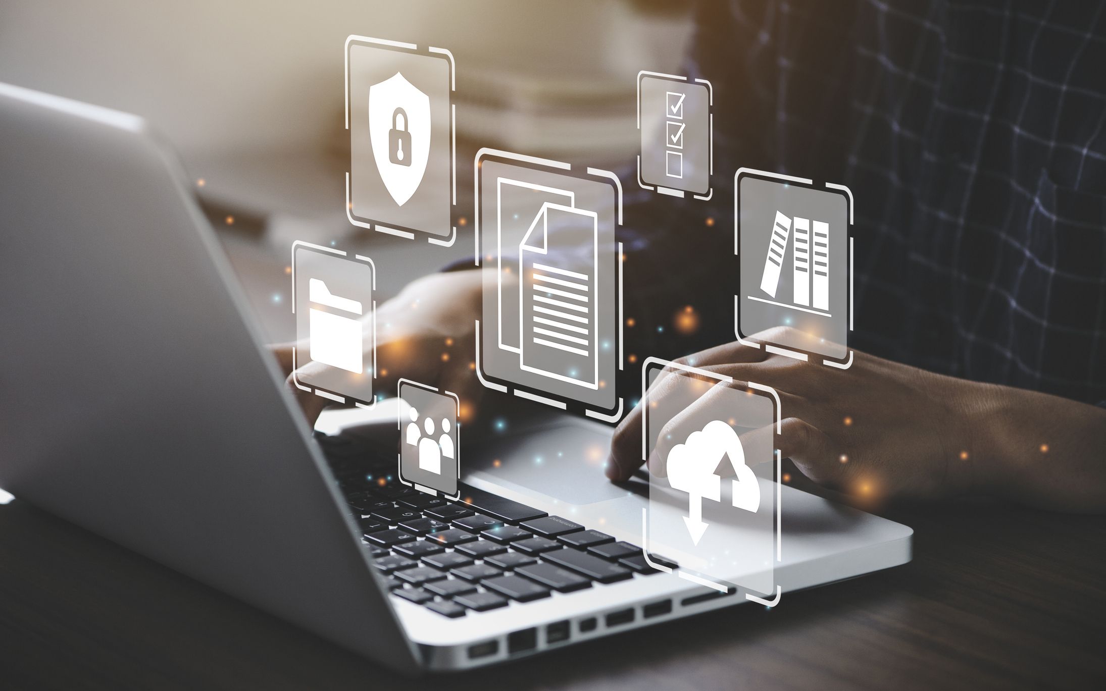 A person types on a laptop with digital icons representing data management and security around it. The icons include a padlock, folders, documents, a checklist, and cloud storage, emphasizing the importance of data management in engineering.